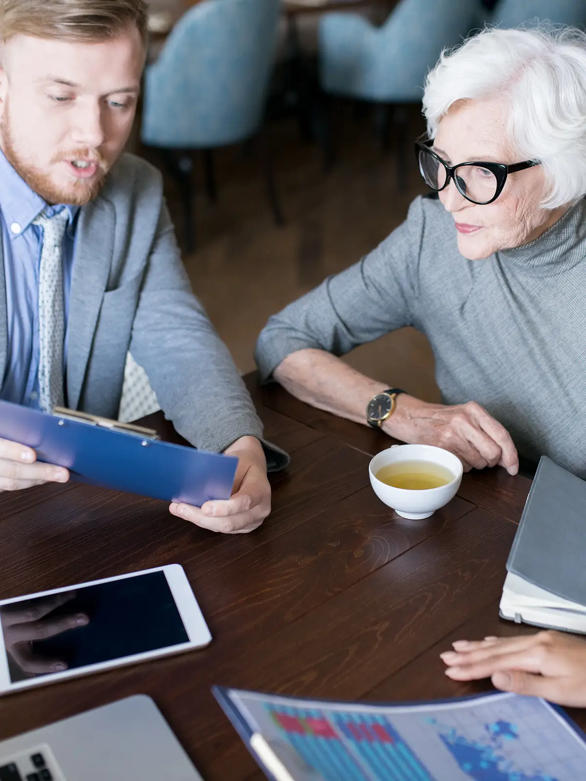 Senior couple reviewing Social Security benefits with financial advisor
